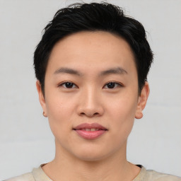 Joyful asian young-adult female with short  black hair and brown eyes