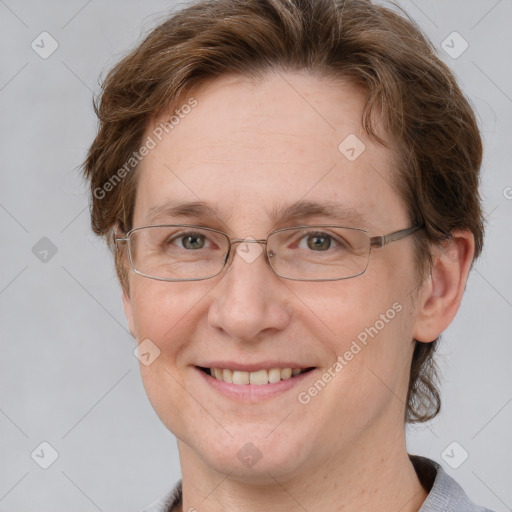 Joyful white adult female with short  brown hair and grey eyes