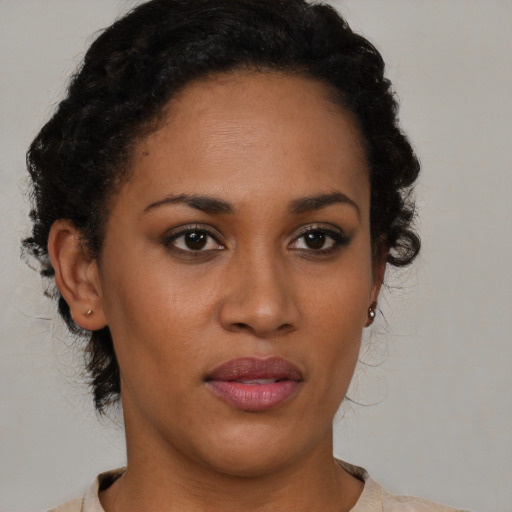 Neutral black young-adult female with short  brown hair and brown eyes