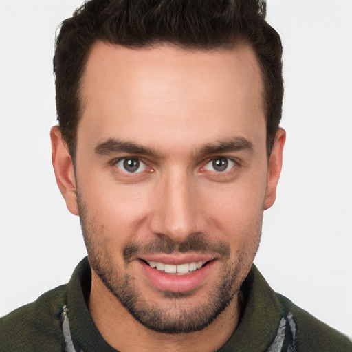 Joyful white young-adult male with short  brown hair and brown eyes