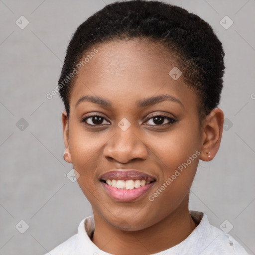 Joyful black young-adult female with short  brown hair and brown eyes