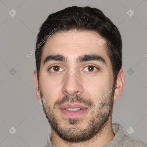 Joyful white young-adult male with short  black hair and brown eyes