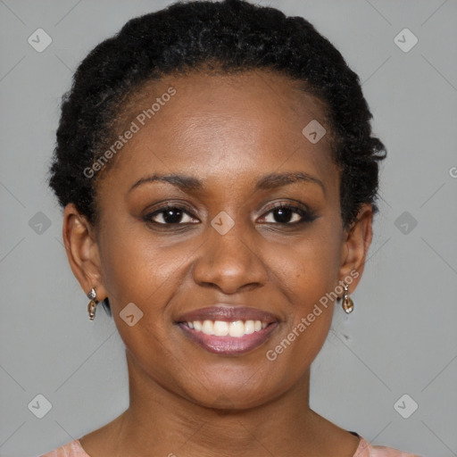 Joyful black young-adult female with short  brown hair and brown eyes