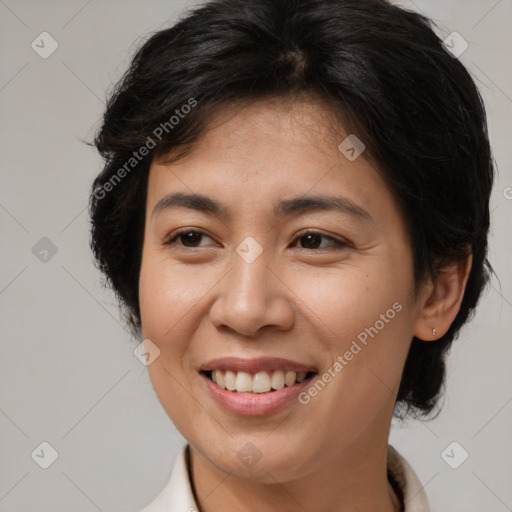 Joyful latino adult female with medium  brown hair and brown eyes