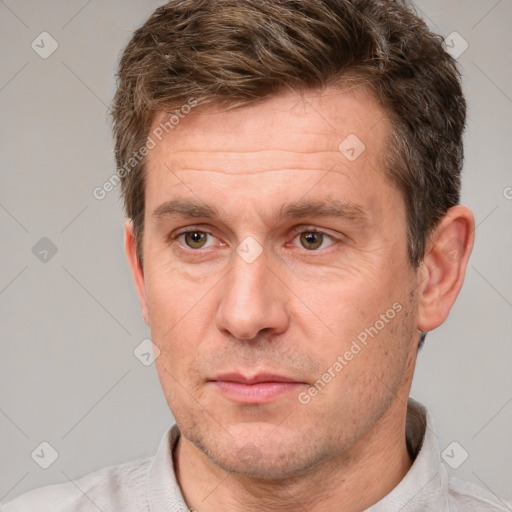 Neutral white adult male with short  brown hair and brown eyes