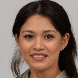 Joyful white adult female with medium  brown hair and brown eyes