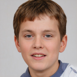 Joyful white child male with short  brown hair and brown eyes