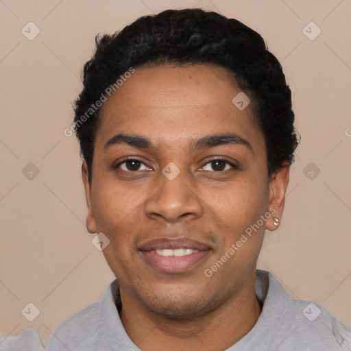 Joyful black young-adult male with short  black hair and brown eyes