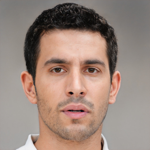 Neutral white young-adult male with short  black hair and brown eyes