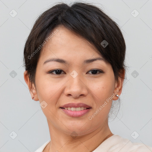 Joyful asian young-adult female with short  brown hair and brown eyes