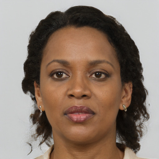 Neutral black adult female with medium  brown hair and brown eyes