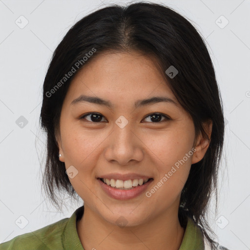 Joyful asian young-adult female with medium  brown hair and brown eyes