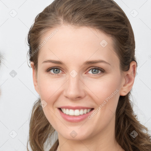 Joyful white young-adult female with long  brown hair and grey eyes