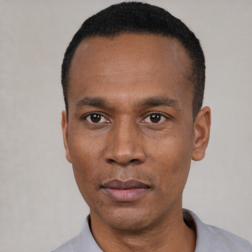 Neutral black adult male with short  black hair and brown eyes