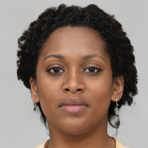 Neutral black young-adult female with short  brown hair and brown eyes