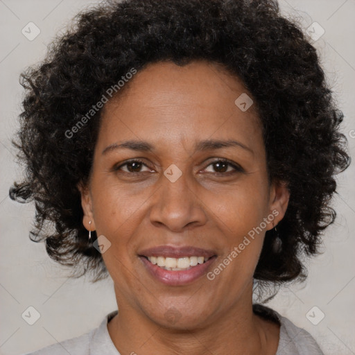 Joyful black adult female with short  brown hair and brown eyes