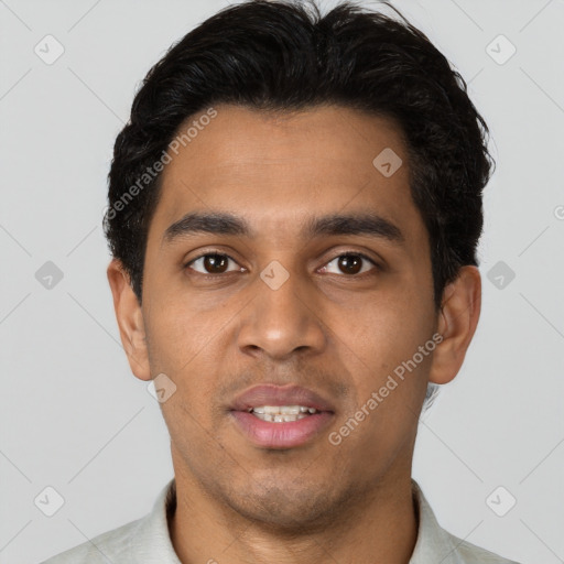 Joyful latino young-adult male with short  black hair and brown eyes