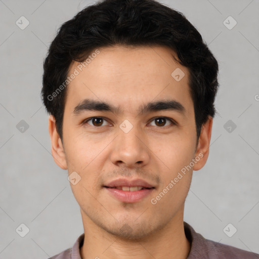 Joyful latino young-adult male with short  brown hair and brown eyes