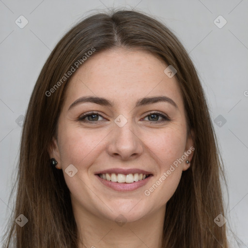 Joyful white young-adult female with long  brown hair and grey eyes