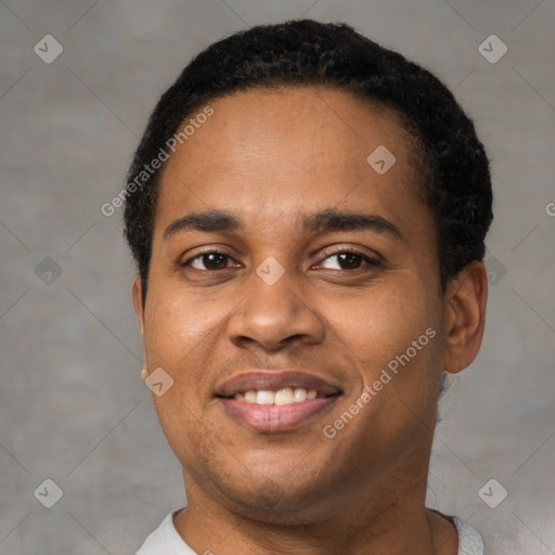 Joyful latino young-adult male with short  black hair and brown eyes