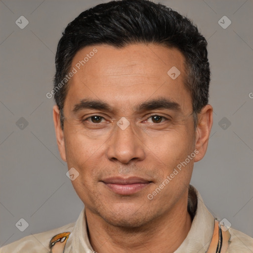 Joyful latino adult male with short  black hair and brown eyes