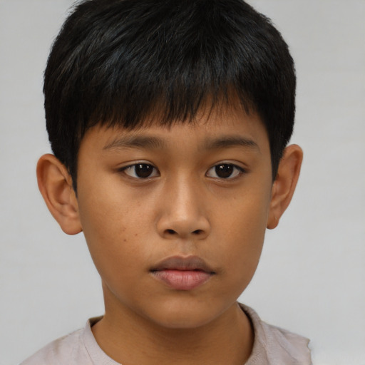 Neutral asian child male with short  brown hair and brown eyes