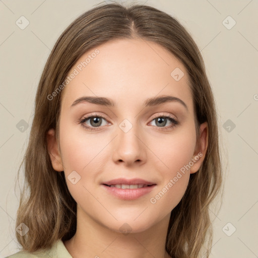 Joyful white young-adult female with long  brown hair and green eyes