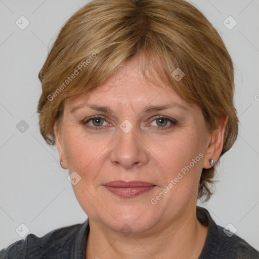 Joyful white adult female with medium  brown hair and blue eyes