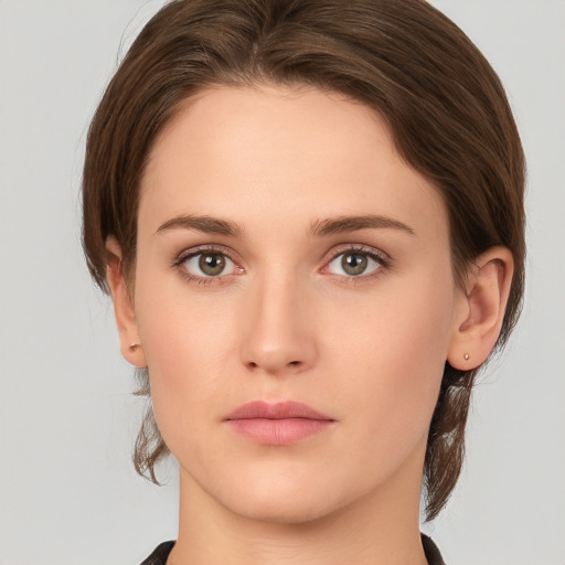 Neutral white young-adult female with medium  brown hair and green eyes