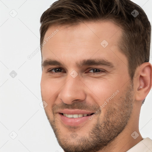 Joyful white young-adult male with short  brown hair and brown eyes