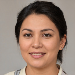 Joyful white young-adult female with medium  brown hair and brown eyes