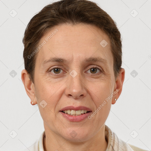 Joyful white adult female with short  brown hair and grey eyes