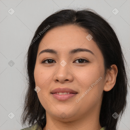 Joyful latino young-adult female with medium  brown hair and brown eyes