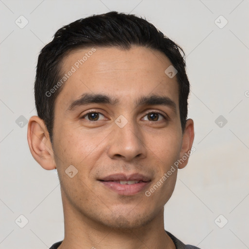 Joyful white young-adult male with short  black hair and brown eyes