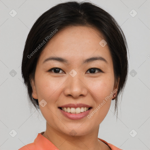 Joyful asian young-adult female with medium  brown hair and brown eyes