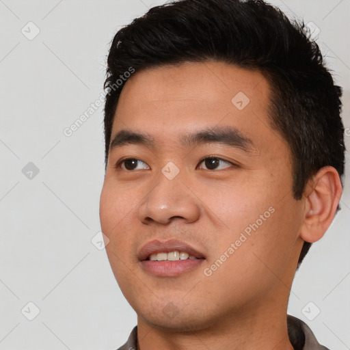 Joyful asian young-adult male with short  black hair and brown eyes