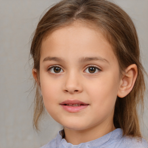 Joyful white child female with medium  brown hair and brown eyes