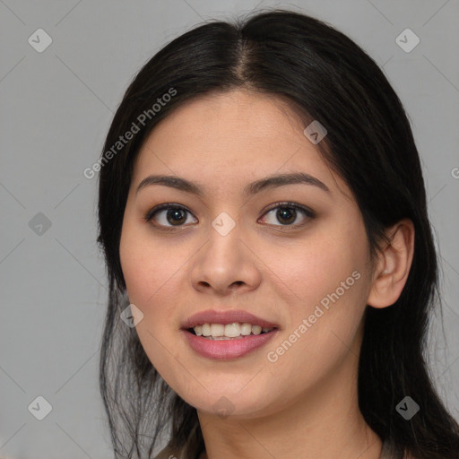 Joyful asian young-adult female with long  brown hair and brown eyes