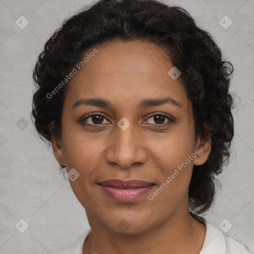 Joyful black adult female with medium  brown hair and brown eyes