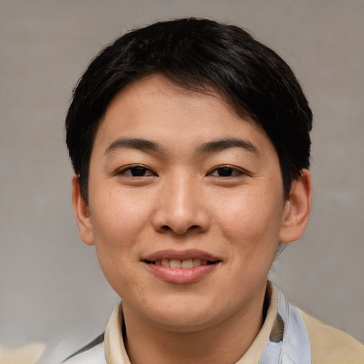 Joyful asian young-adult female with short  brown hair and brown eyes