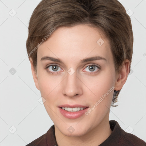 Joyful white young-adult female with short  brown hair and grey eyes