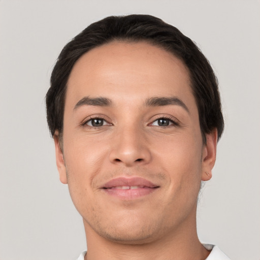 Joyful white young-adult male with short  brown hair and brown eyes