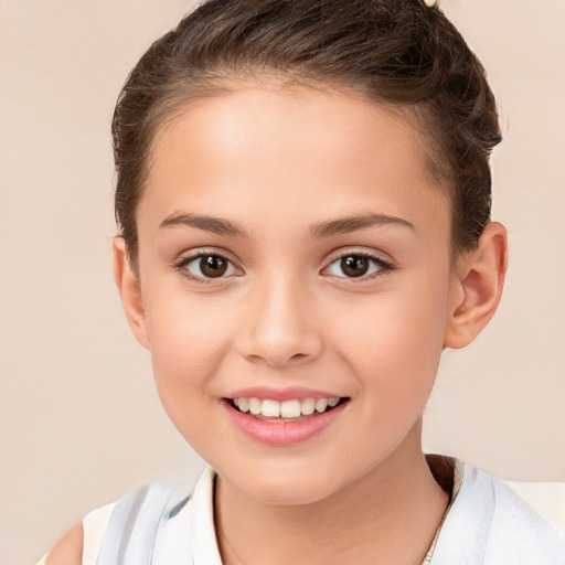 Joyful white child female with short  brown hair and brown eyes