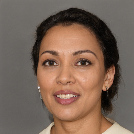 Joyful white adult female with medium  brown hair and brown eyes