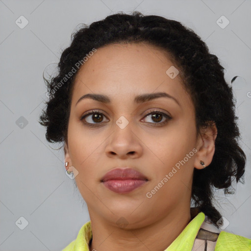 Joyful black young-adult female with medium  brown hair and brown eyes