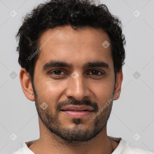 Joyful latino young-adult male with short  black hair and brown eyes