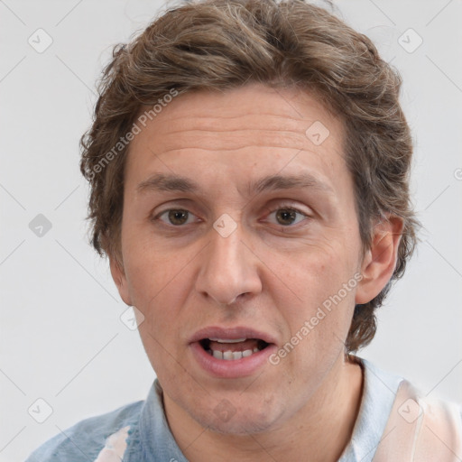 Joyful white adult male with short  brown hair and grey eyes