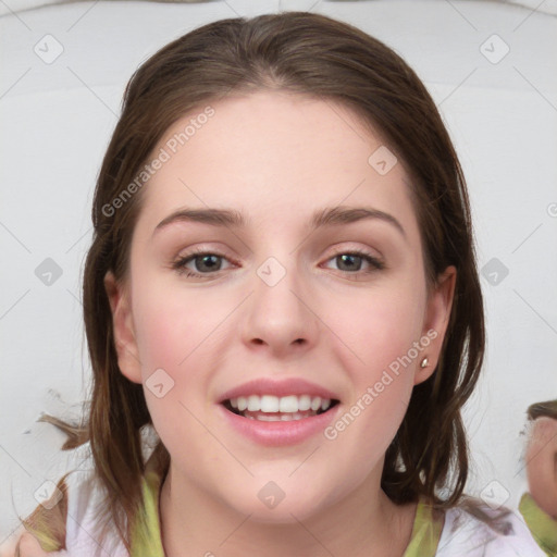 Joyful white young-adult female with medium  brown hair and blue eyes