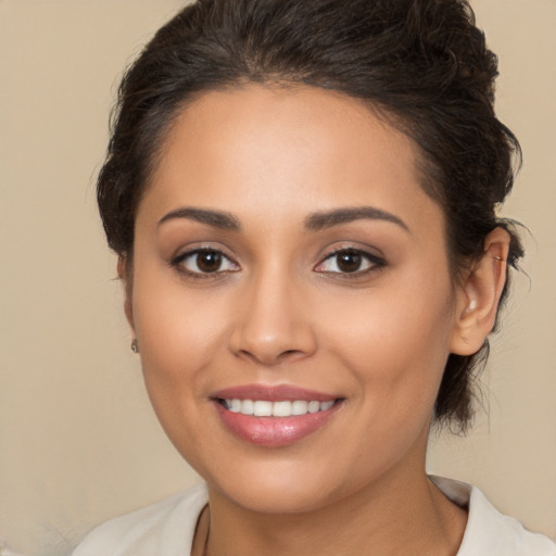 Joyful white young-adult female with medium  brown hair and brown eyes