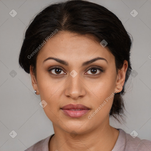 Joyful latino young-adult female with medium  brown hair and brown eyes